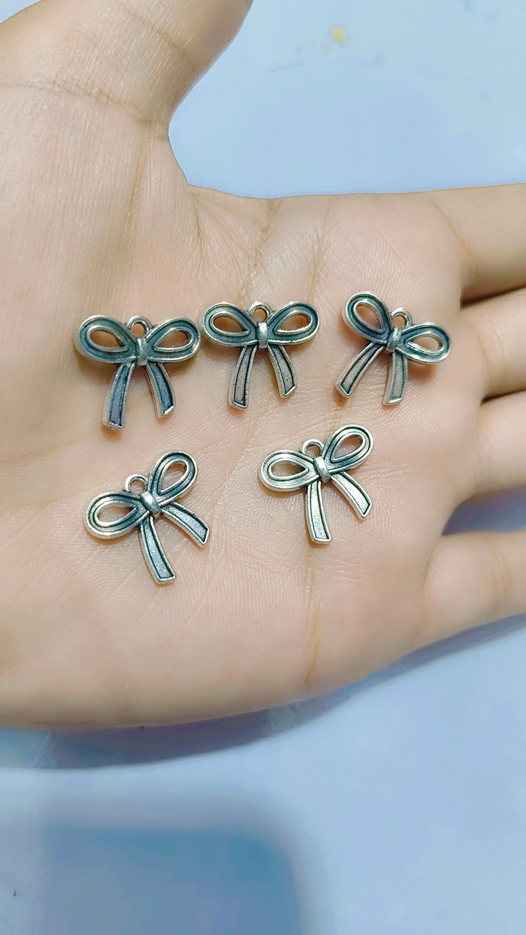 Silver bow charms