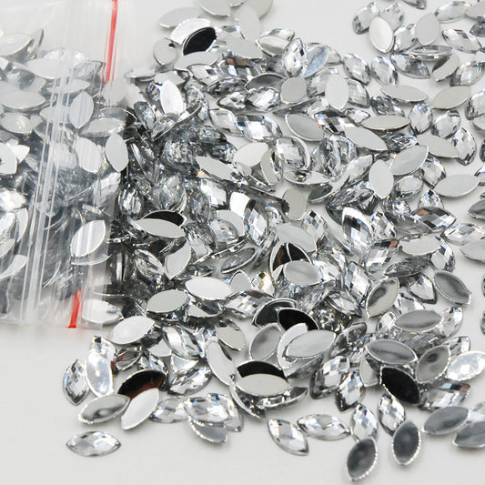 5x10mm (approx. 13/64" x 7/16") acrylic rhinestones feature a faceted navette (horse eye) shape and a flat back for easy glue-on or self-adhesive application